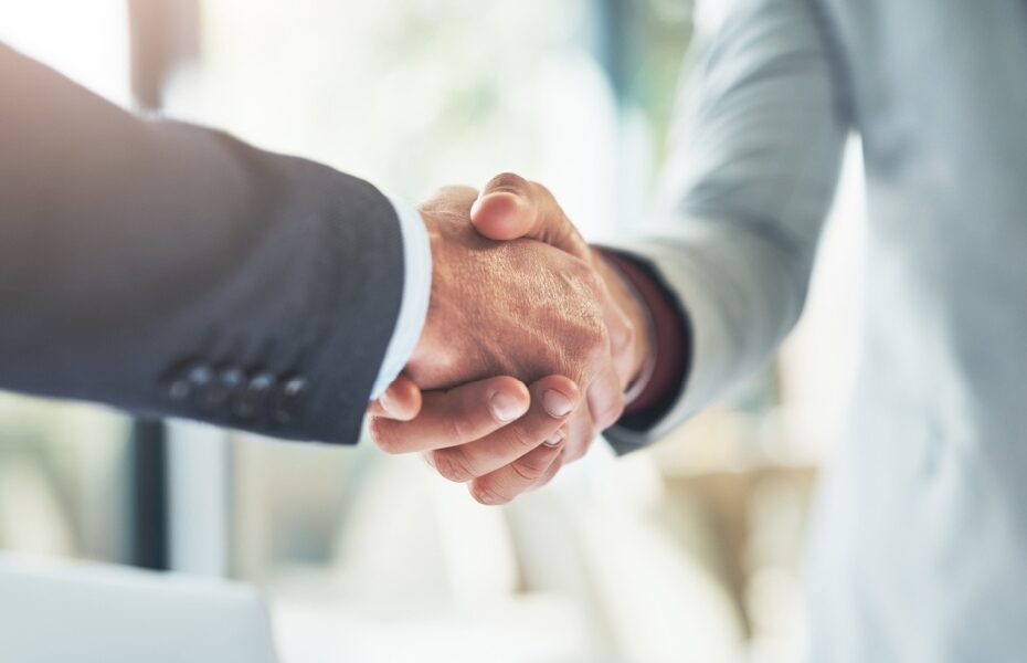 Two people shaking hands.