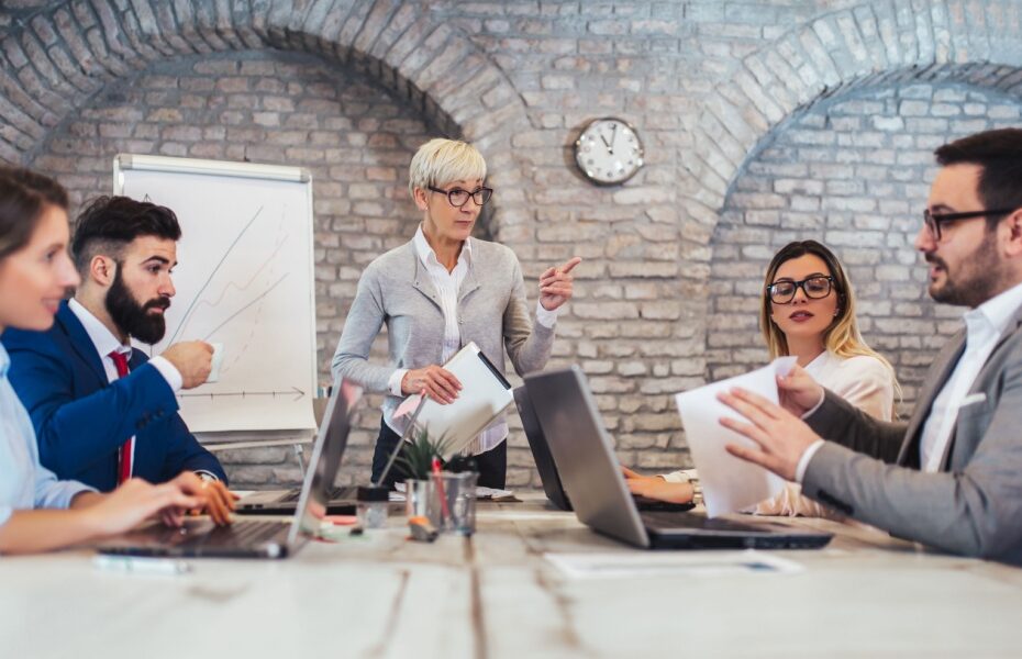 A group of colleagues sitting around a conference table.