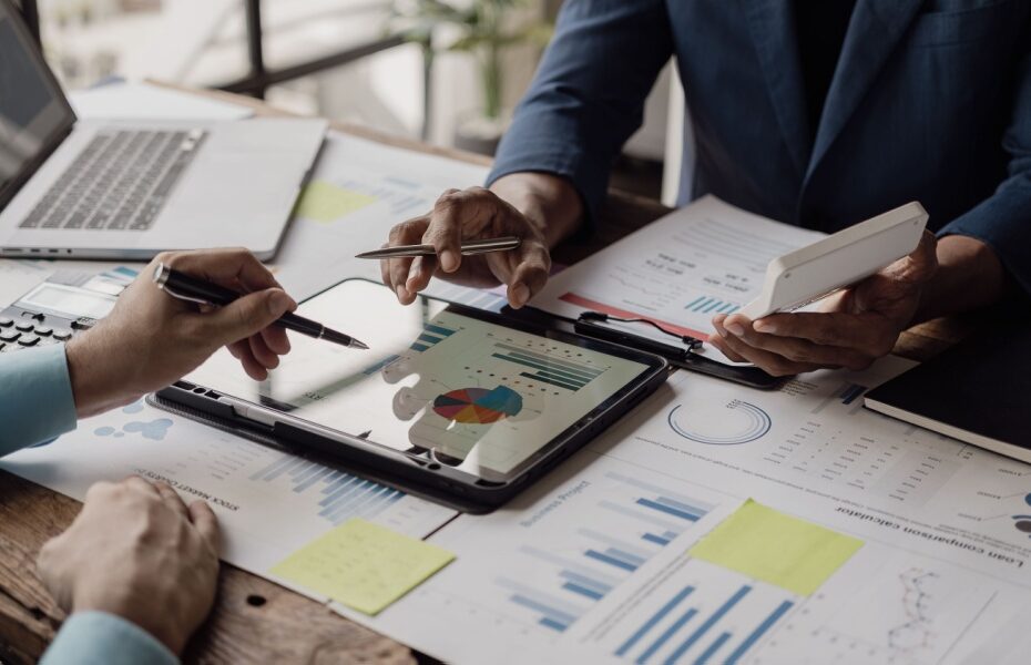 Business people looking at documents in an office.