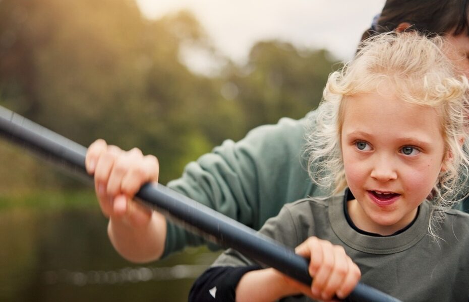 A mum and child kayaking.
