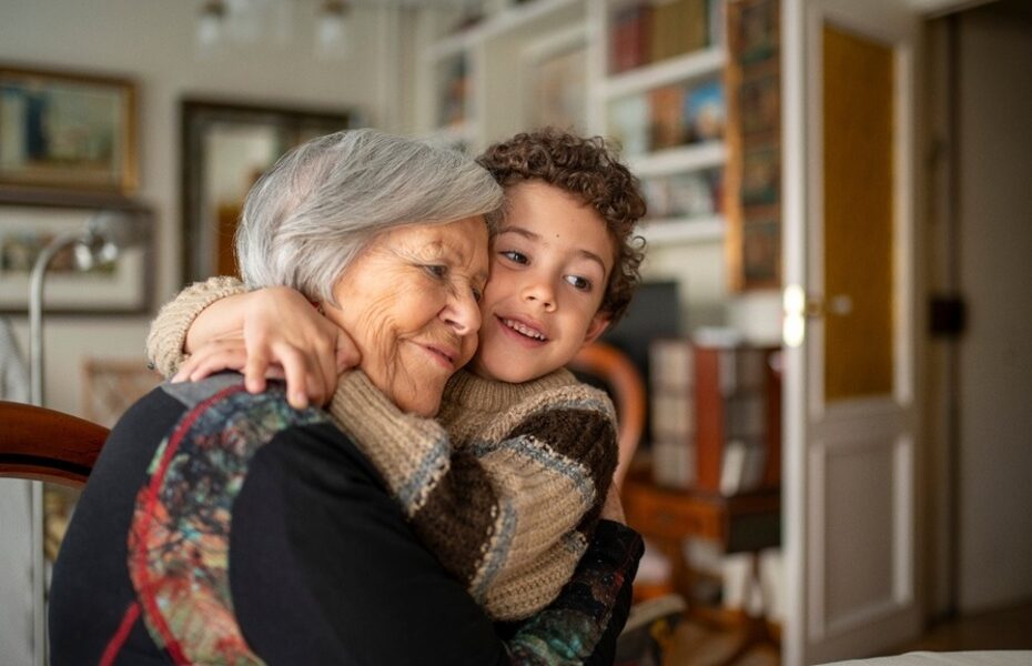 A woman hugging her grandchild.