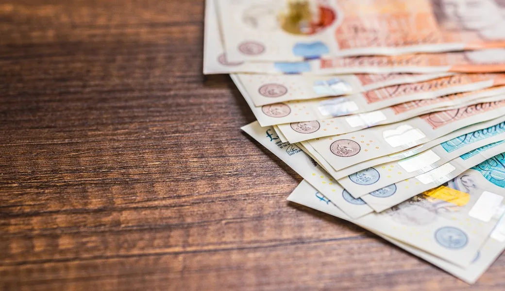 UK bank notes on a table.